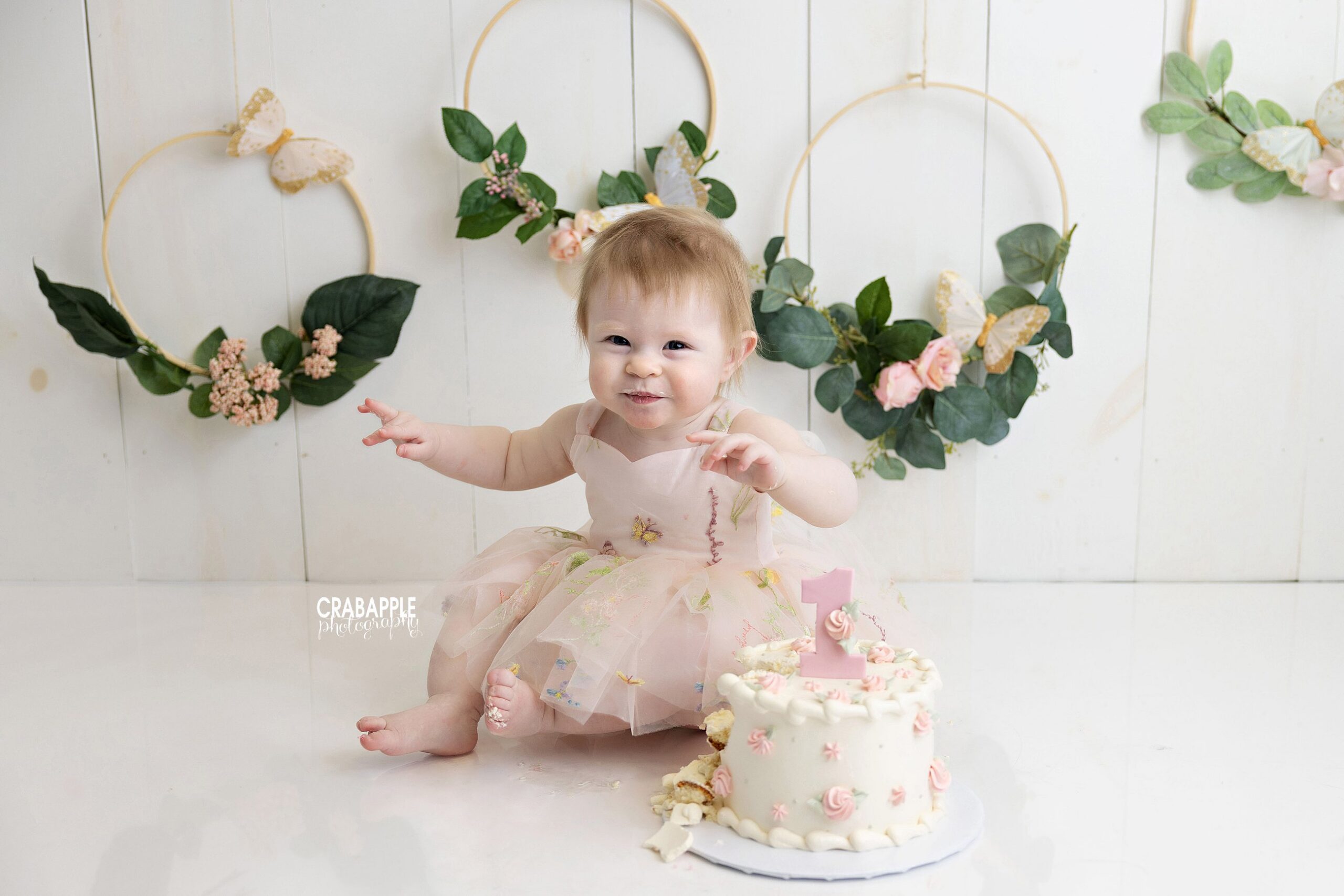floral cake smash portrait baby girl