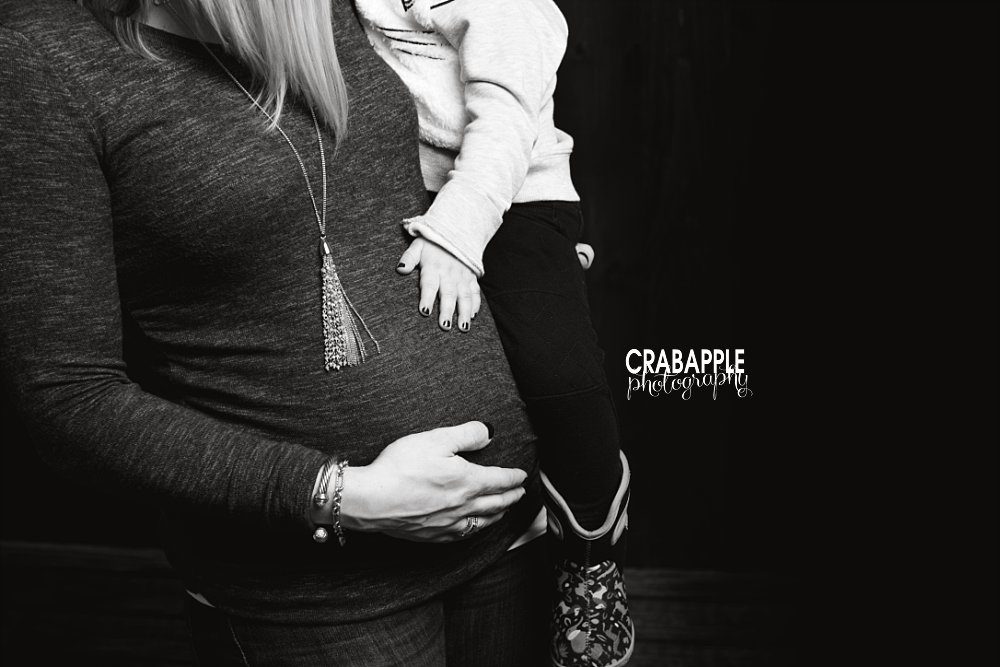 professional maternity photo with older sister
