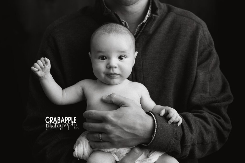 baby milestone photography session with parent holding 3 month old
