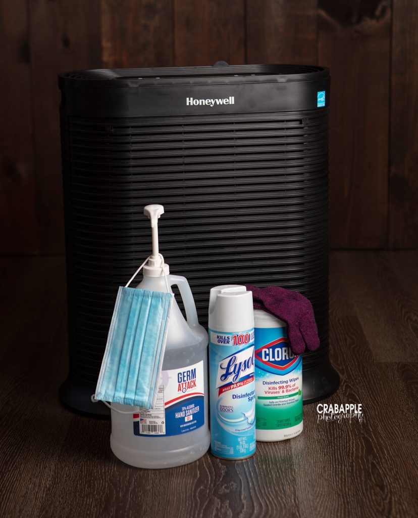 Honeywell HEPA air fitler pump, lysol spray, clorox wipes, hand sanitizer, and face masks to keep our photo studio safe from Covid