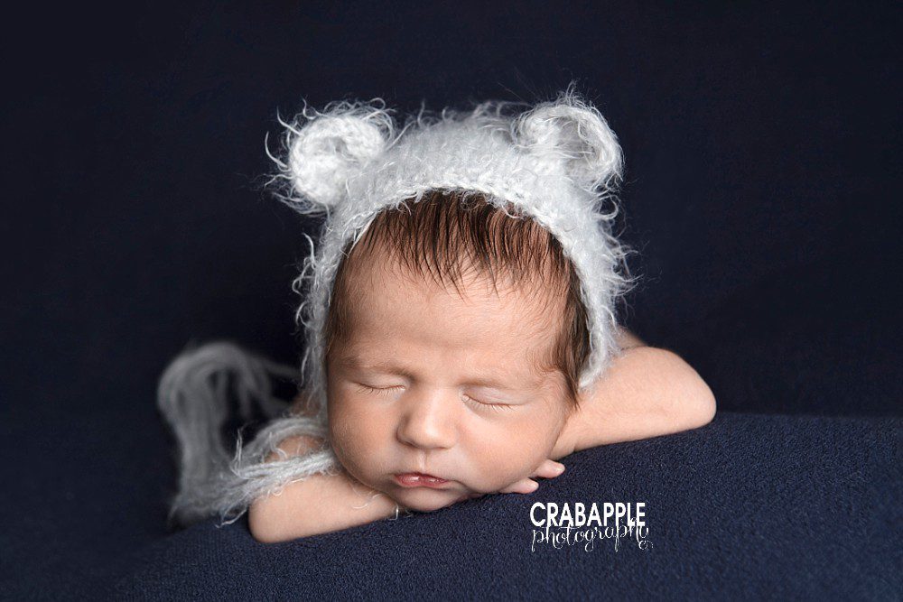 Navy blue and light blue newborn portrait photography of baby boy's face Andover MA