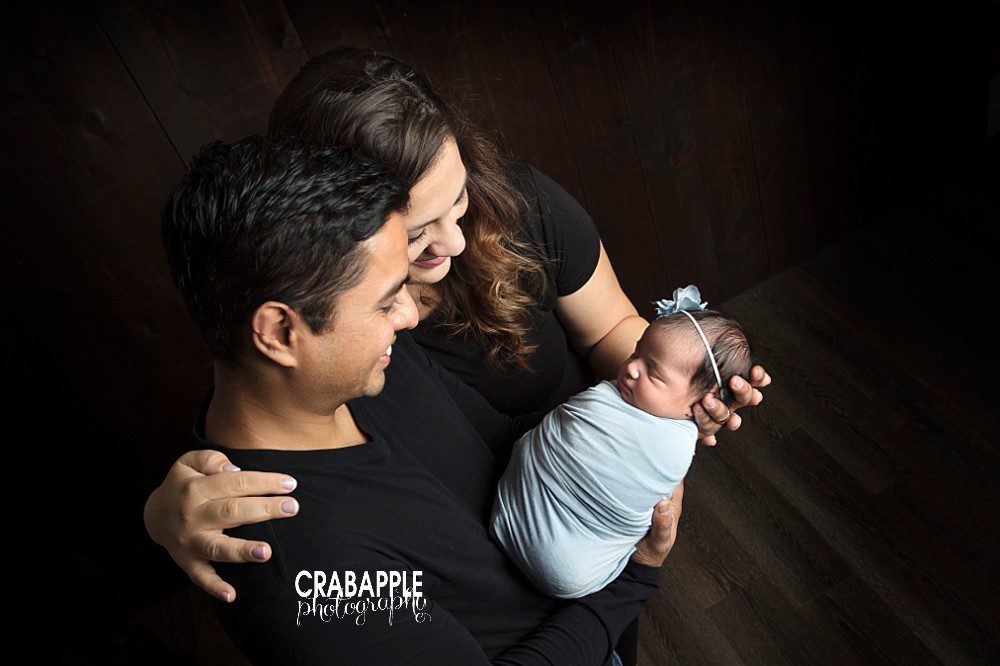 Photos of mom and dad with newborn baby girl