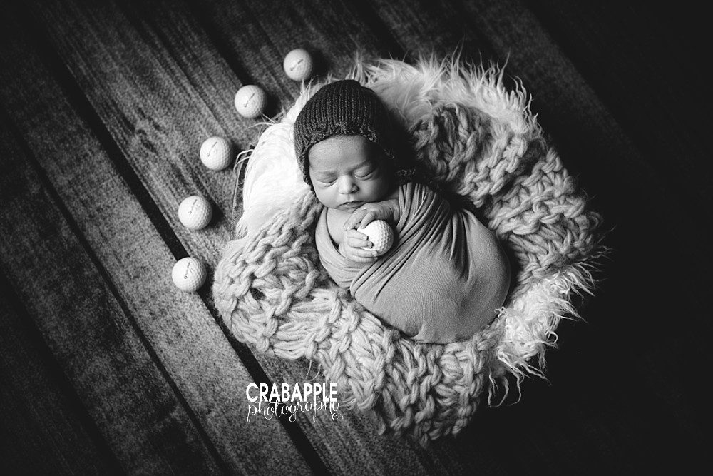 black and white newborn photos with golf balls