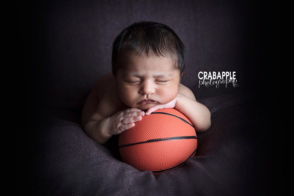 newborn photo with basketball