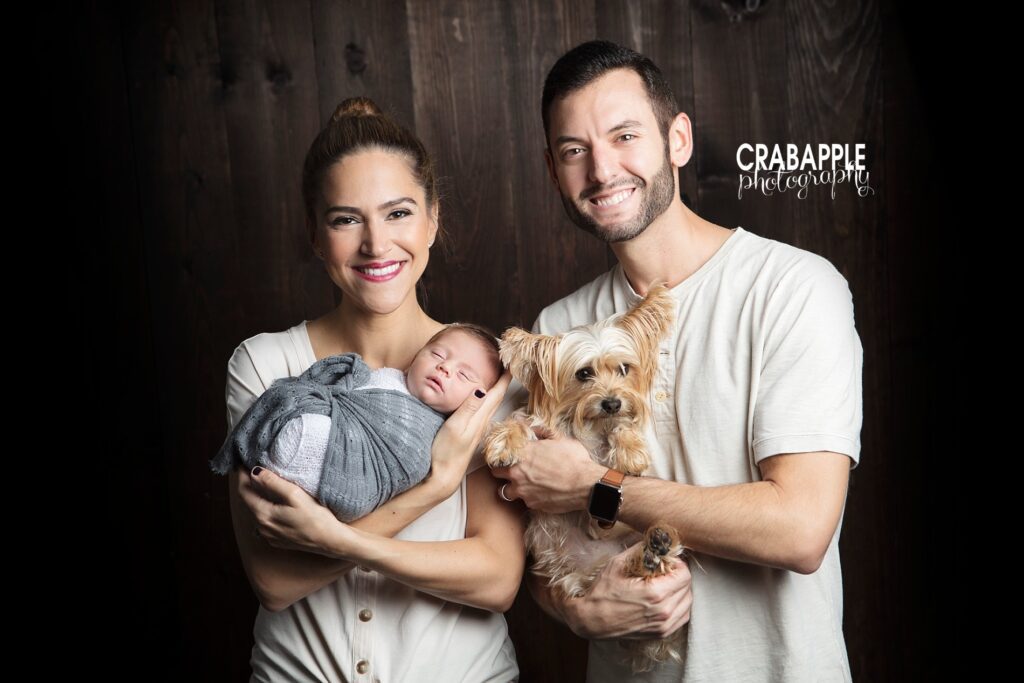 family photo with newborn and pet dog
