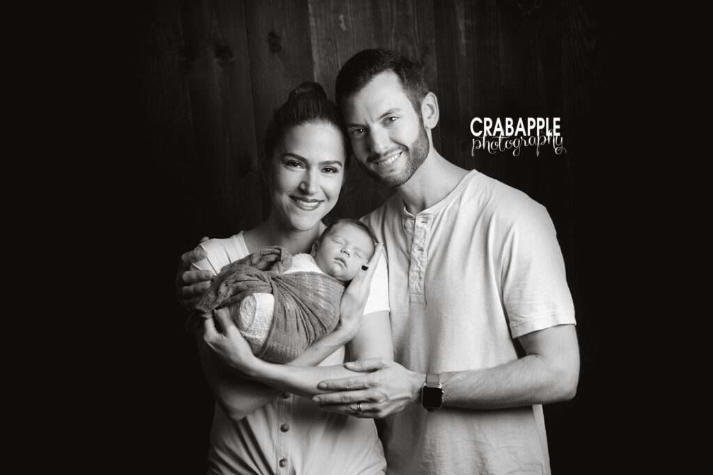 black and white family portraits with new baby