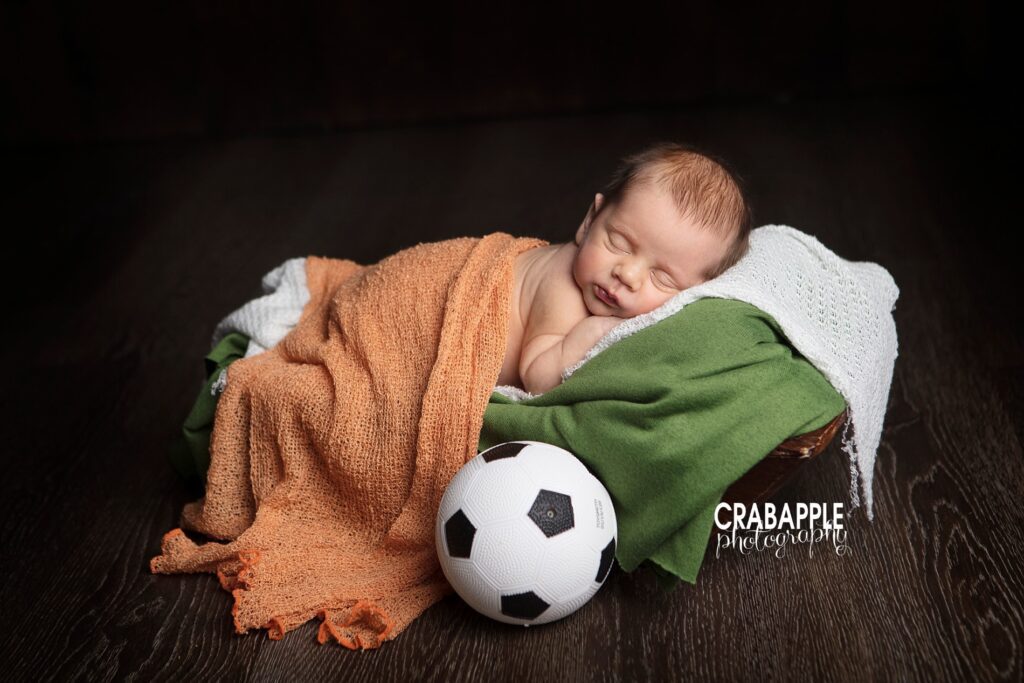 newborn photos using soccer balls and irish colors