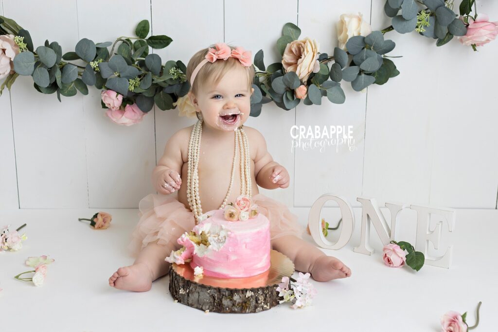 cake smash set ups with flowers and pearls