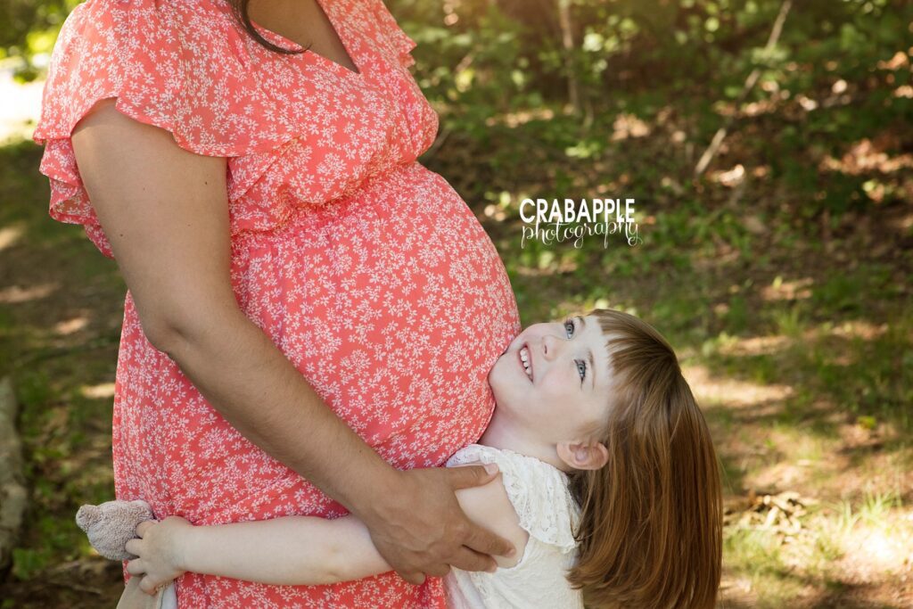 mommy and me maternity photos with daughter outdoor spring photos 