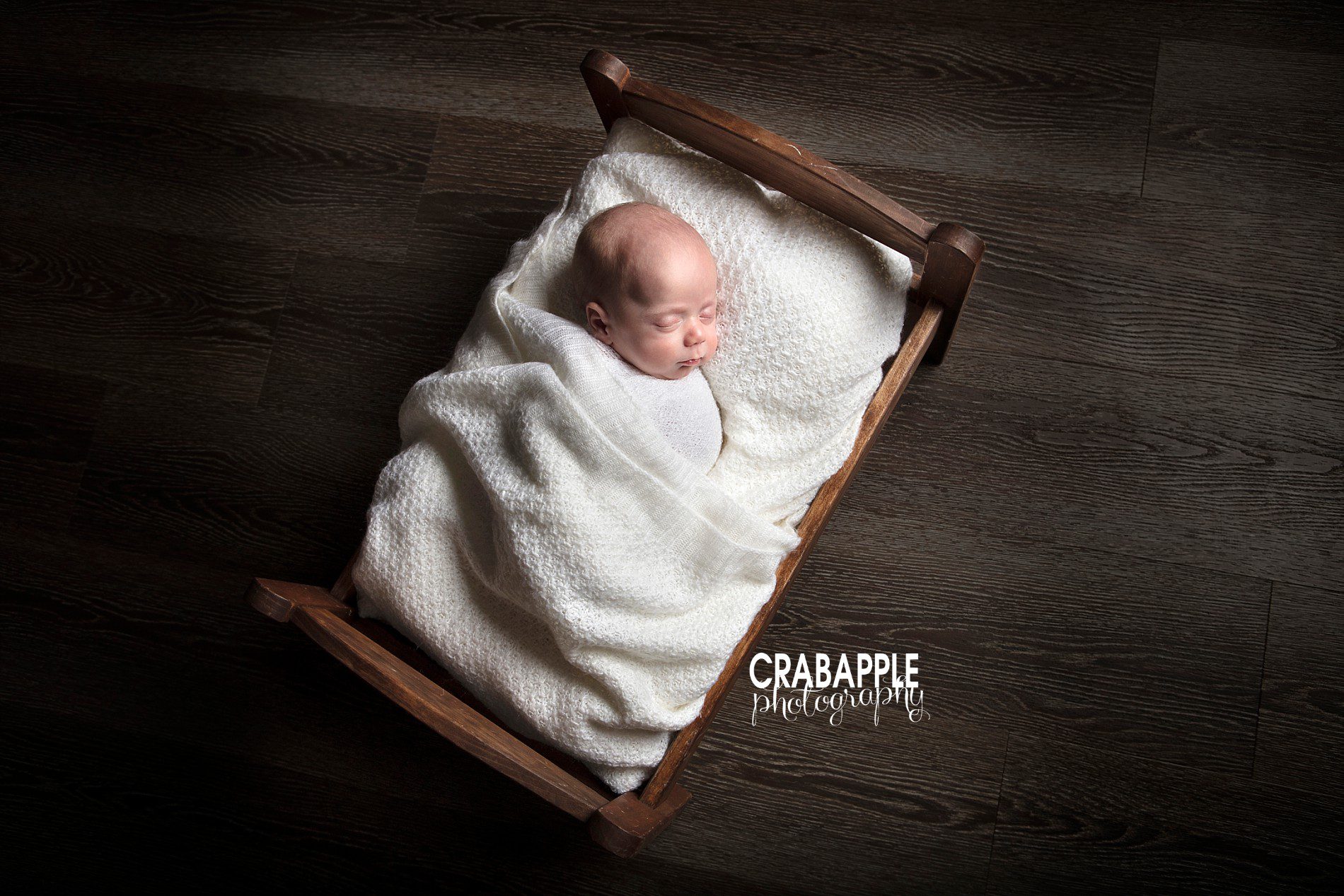 Adorable wooden bed prop for newborn photos in Andover MA photography studio