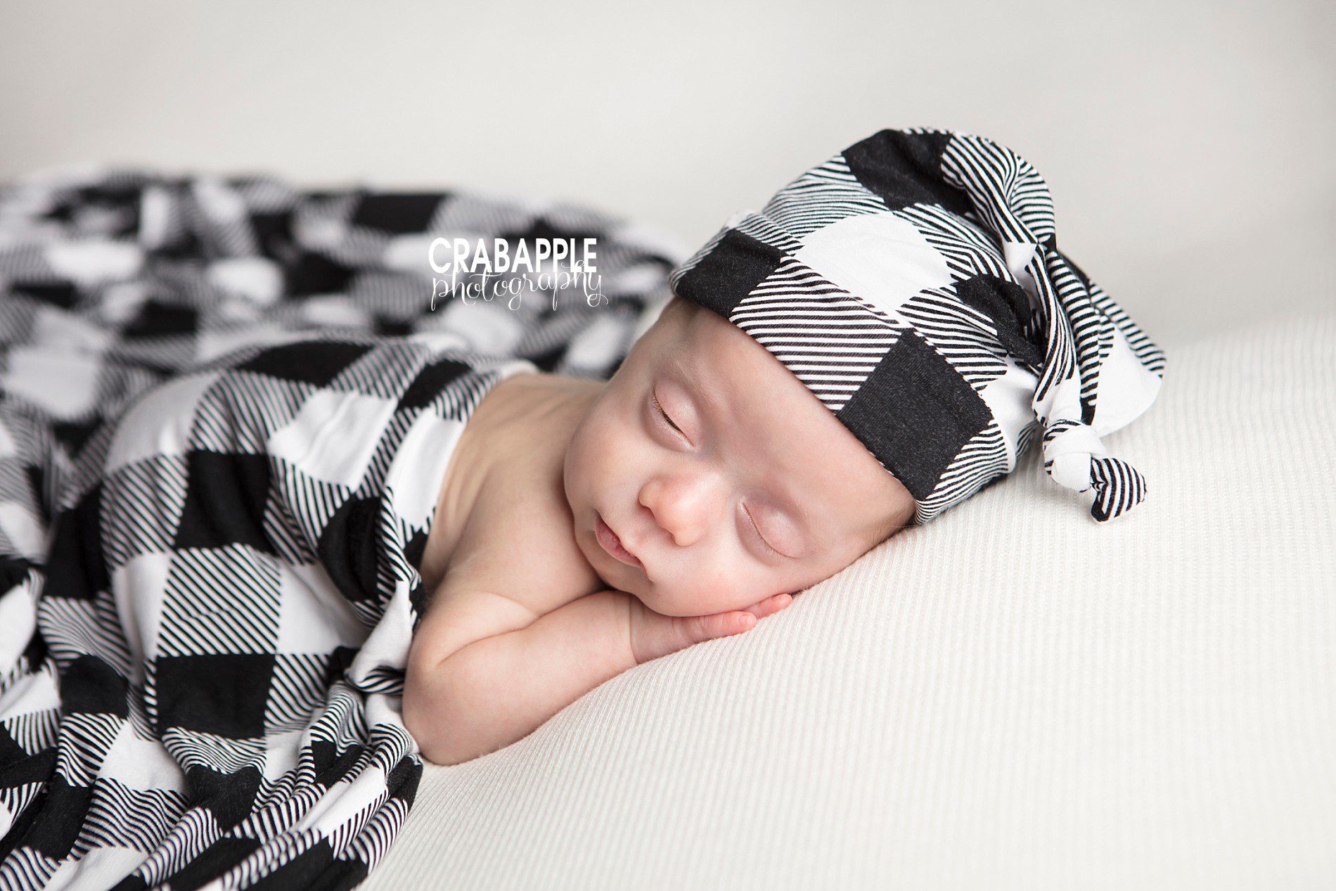 close up sleeping newborn baby boy soft natural light in Andover MA photography studio

