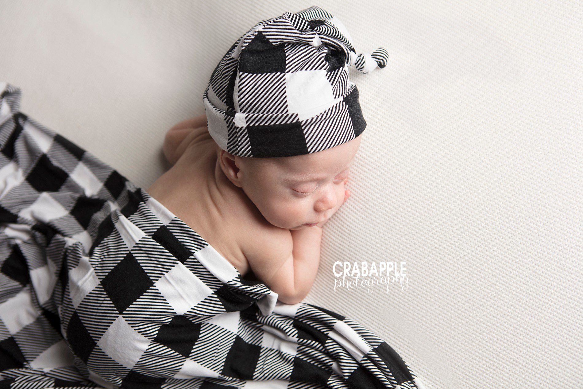 baby boy wrapped in black and white tones studio newborn photography Massachusetts
