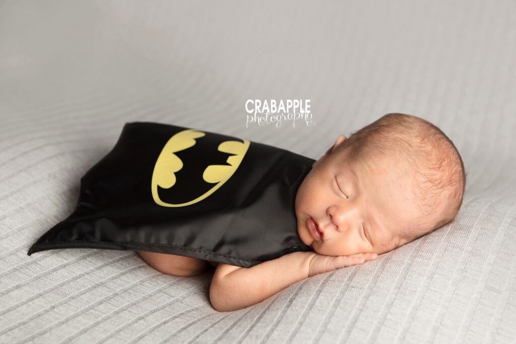 malden newborn photos with batman cape