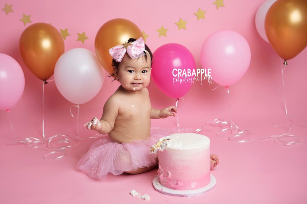 pink and gold cake smash pictures 