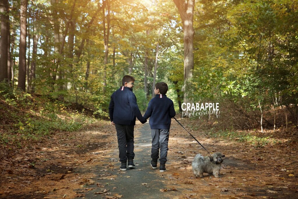outdoor photos of brothers and dog