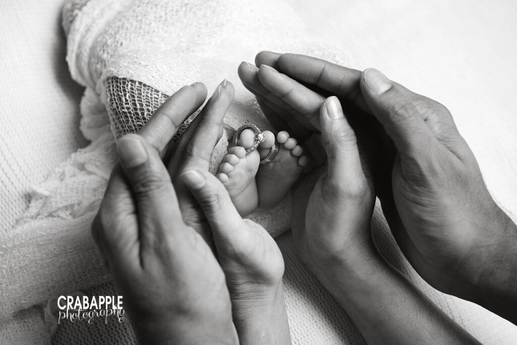 newborn photos with wedding rings
