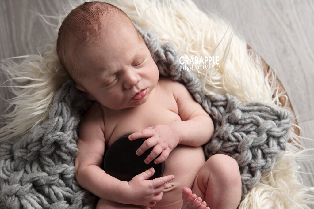 amesbury newborn photography with hockey puck