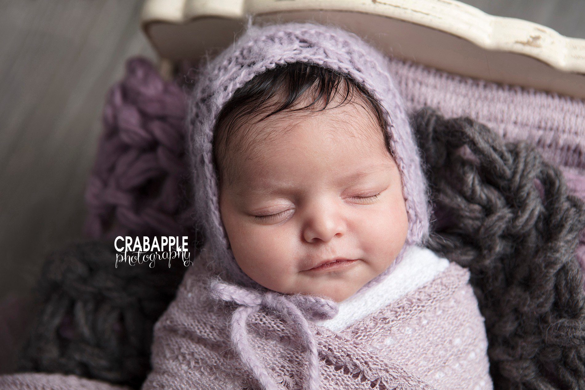 Using various shades of purple for newborn portrait ideas and inspiration