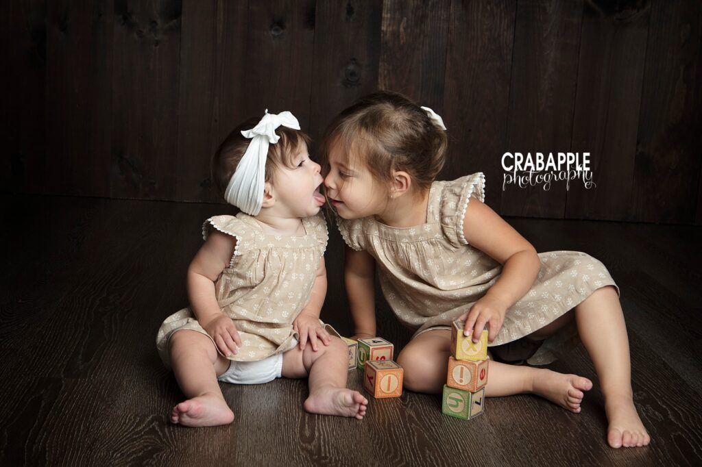 baby photos with older siblings