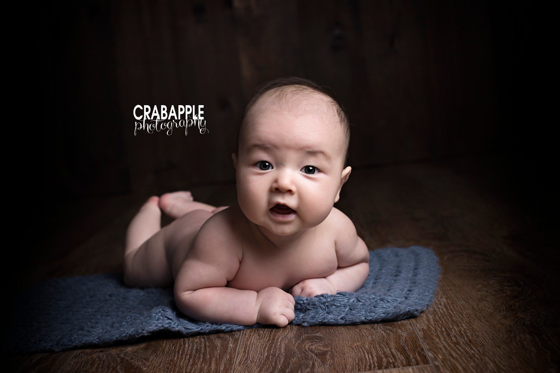 Tummy time portrait idea of 100 day old baby.