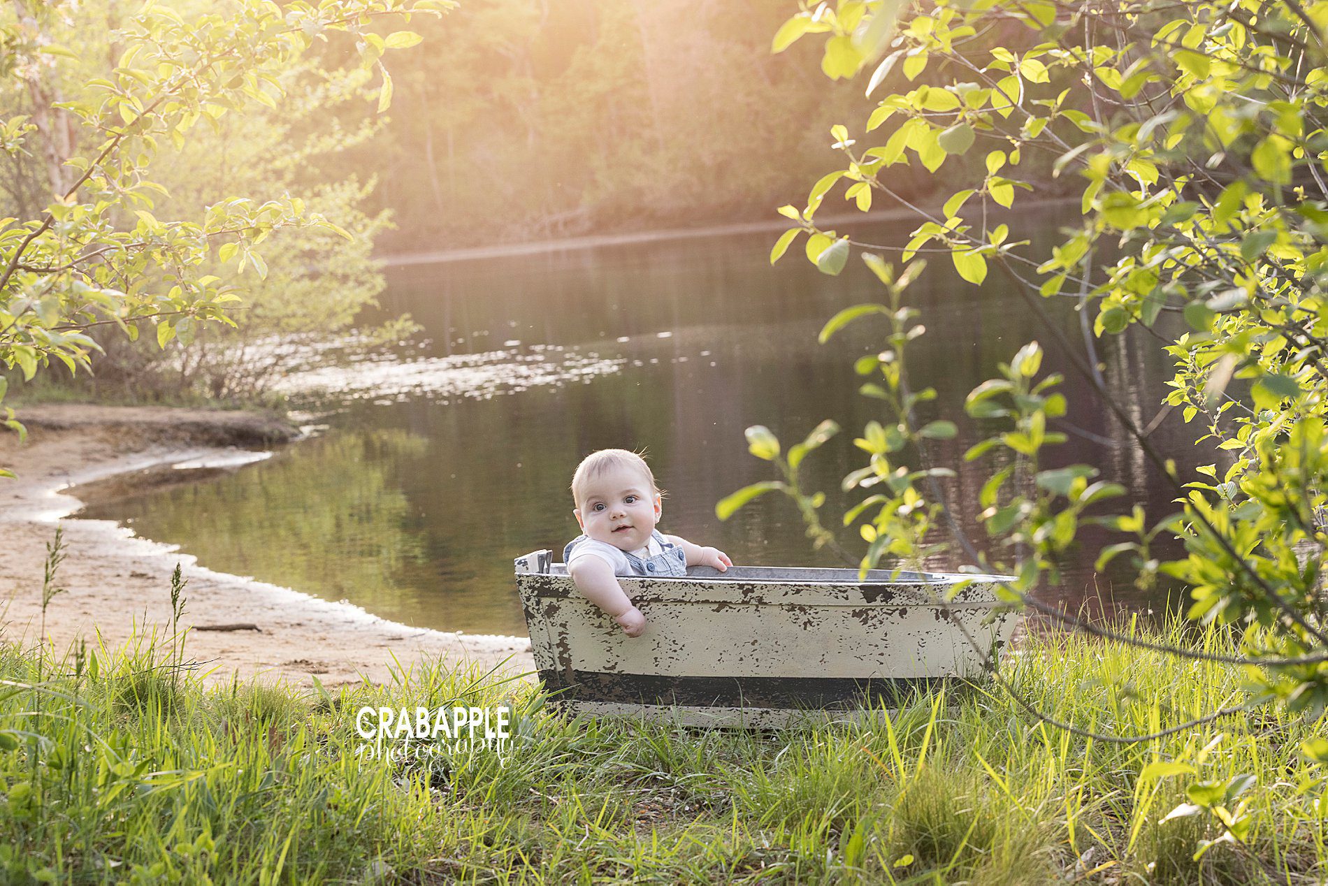 Baby photos using nautical props outside.