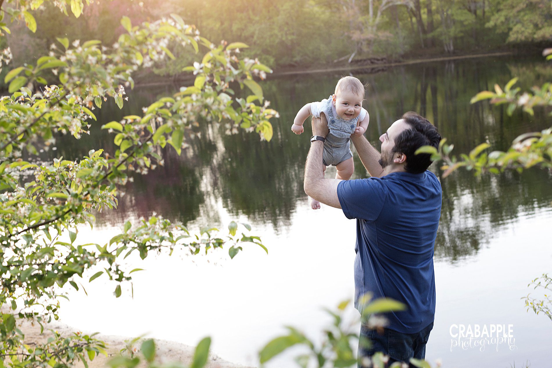 Father and son baby photos outdoors.