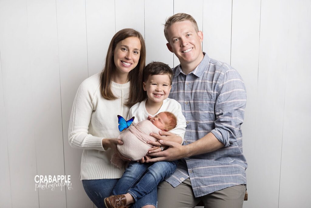 Newborn portraits after child loss | Honoring a stillborn sibling with a digital butterfly Newborn portraits after child loss with symbolic blue butterfly honoring lost brother