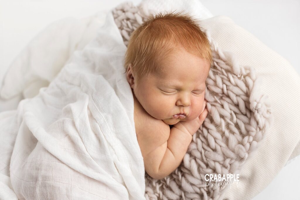 Gentle, loving image of newborn baby girl Sweet portrait of newborn baby girl in soft tones for newborn portraits after child loss