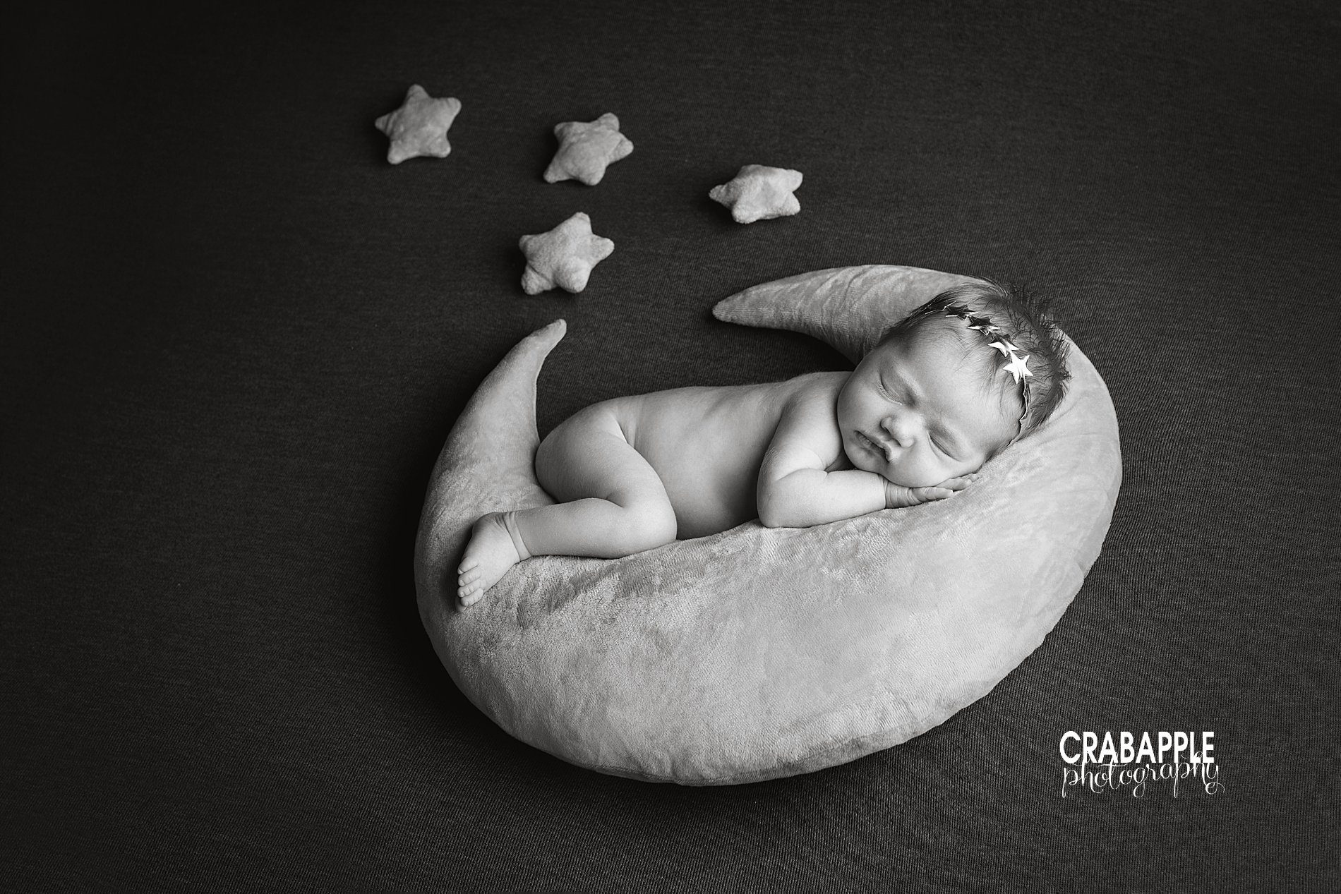 Black and white newborn photos using moon and star props