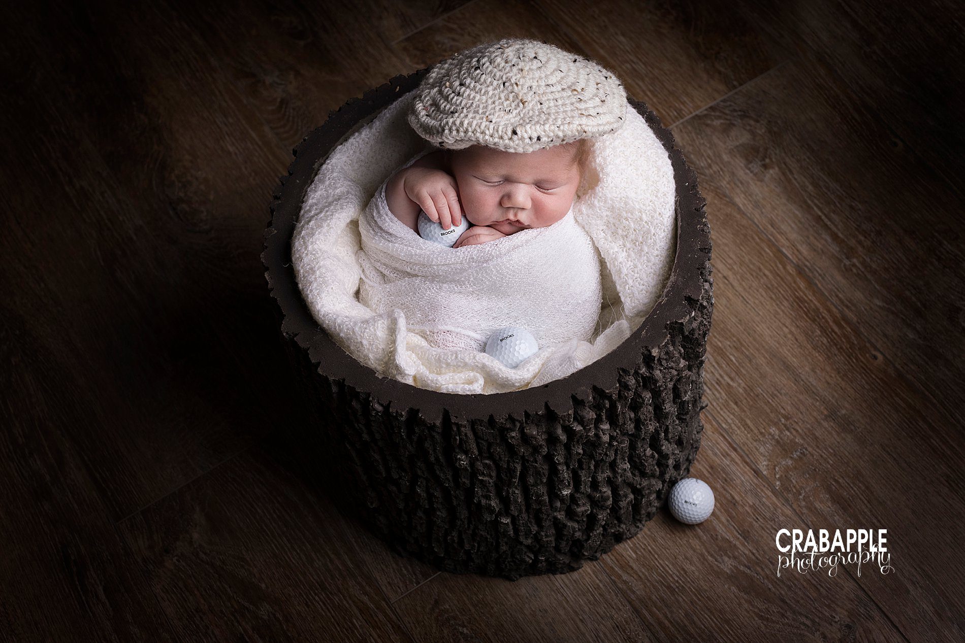 Classic golf themed newborn portraits with knit hat and custom golf balls with baby's name