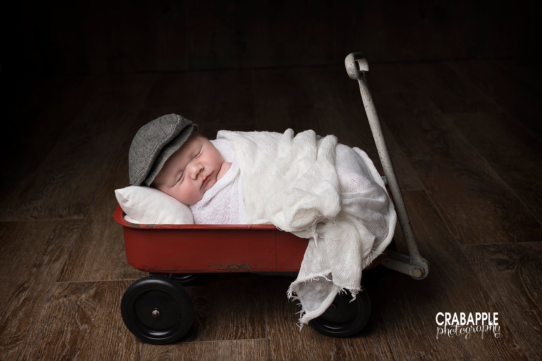 Newborn pictures with vintage red wagon.