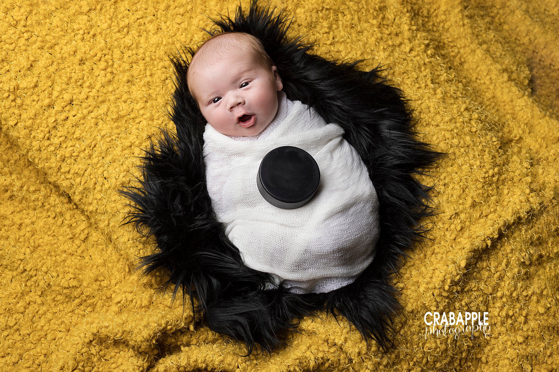 Inspiration for subtle Boston Bruins themed newborn photos