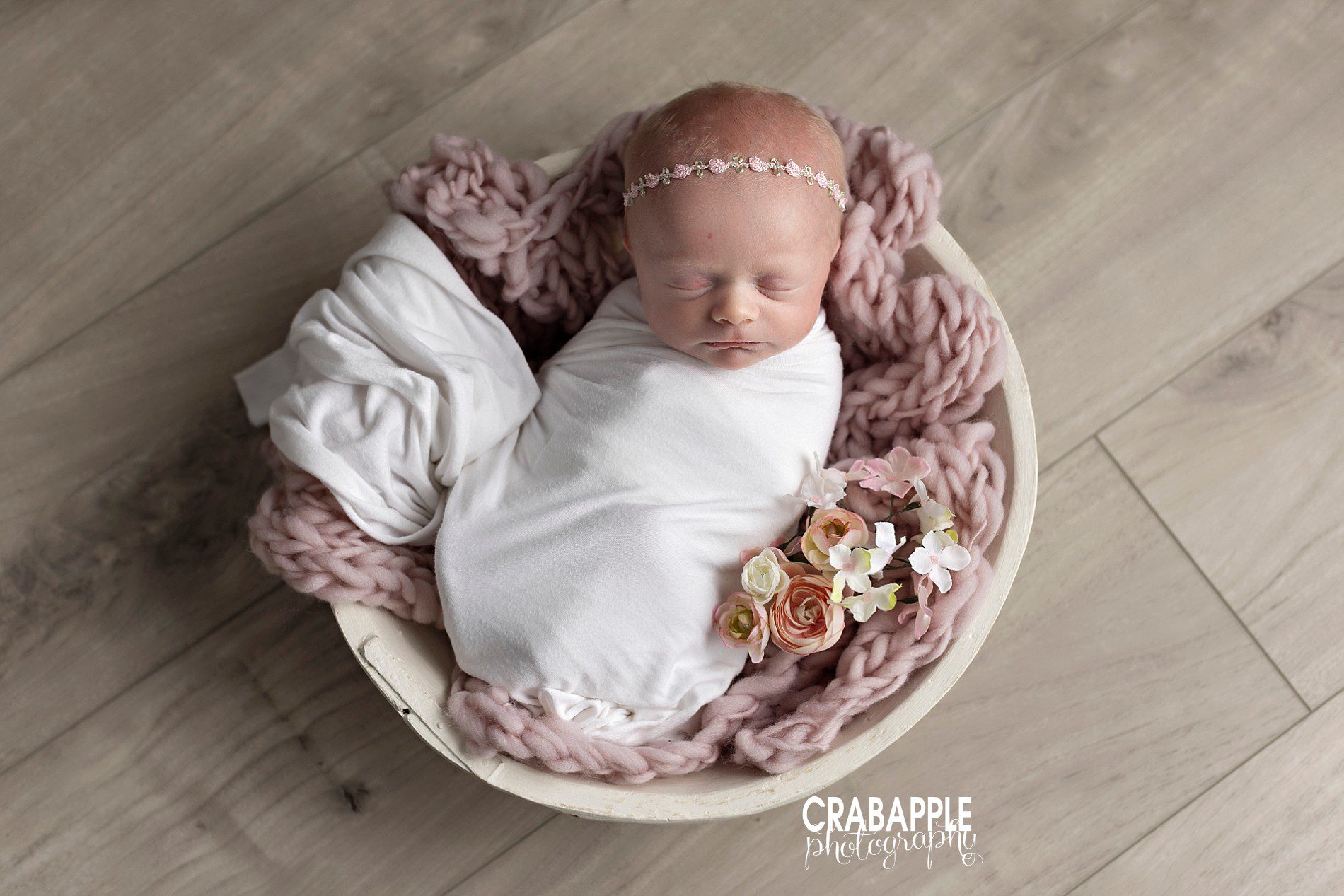 Using pops of dusty pink in newborn portraits for girls.