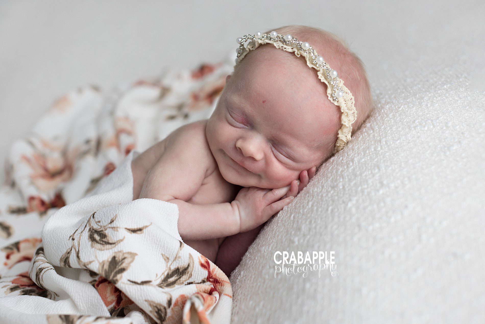 Using dainty headbands and floral blankets in newborn baby girl photos.