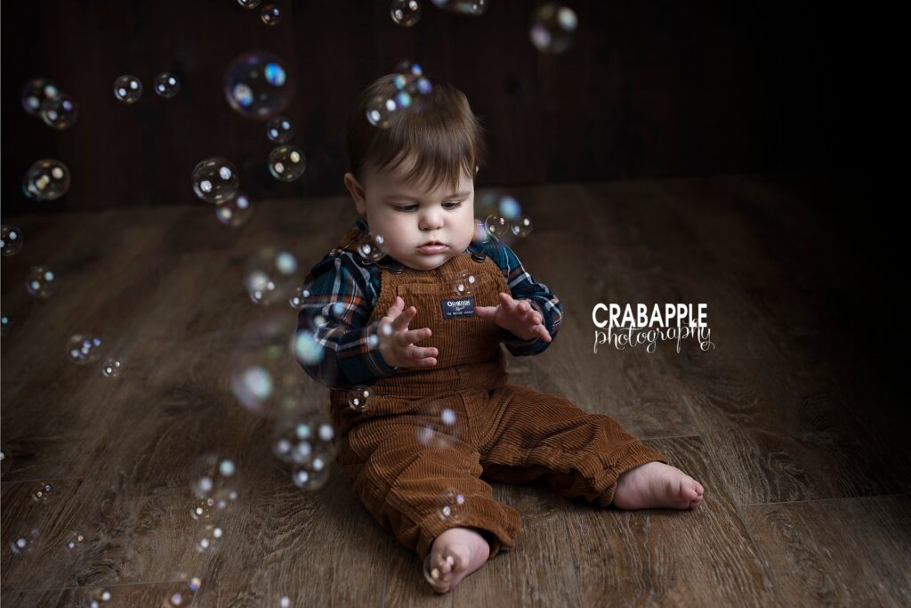 Using bubbles for baby portraits in front of a dark background.