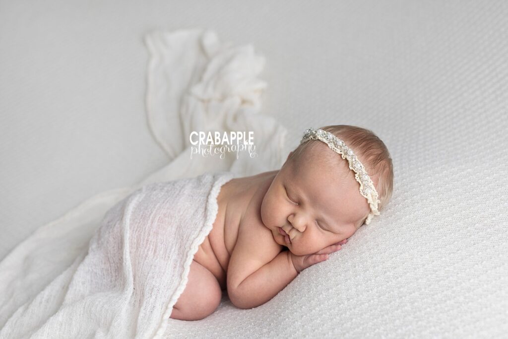 Simple newborn portraits for girls using white.