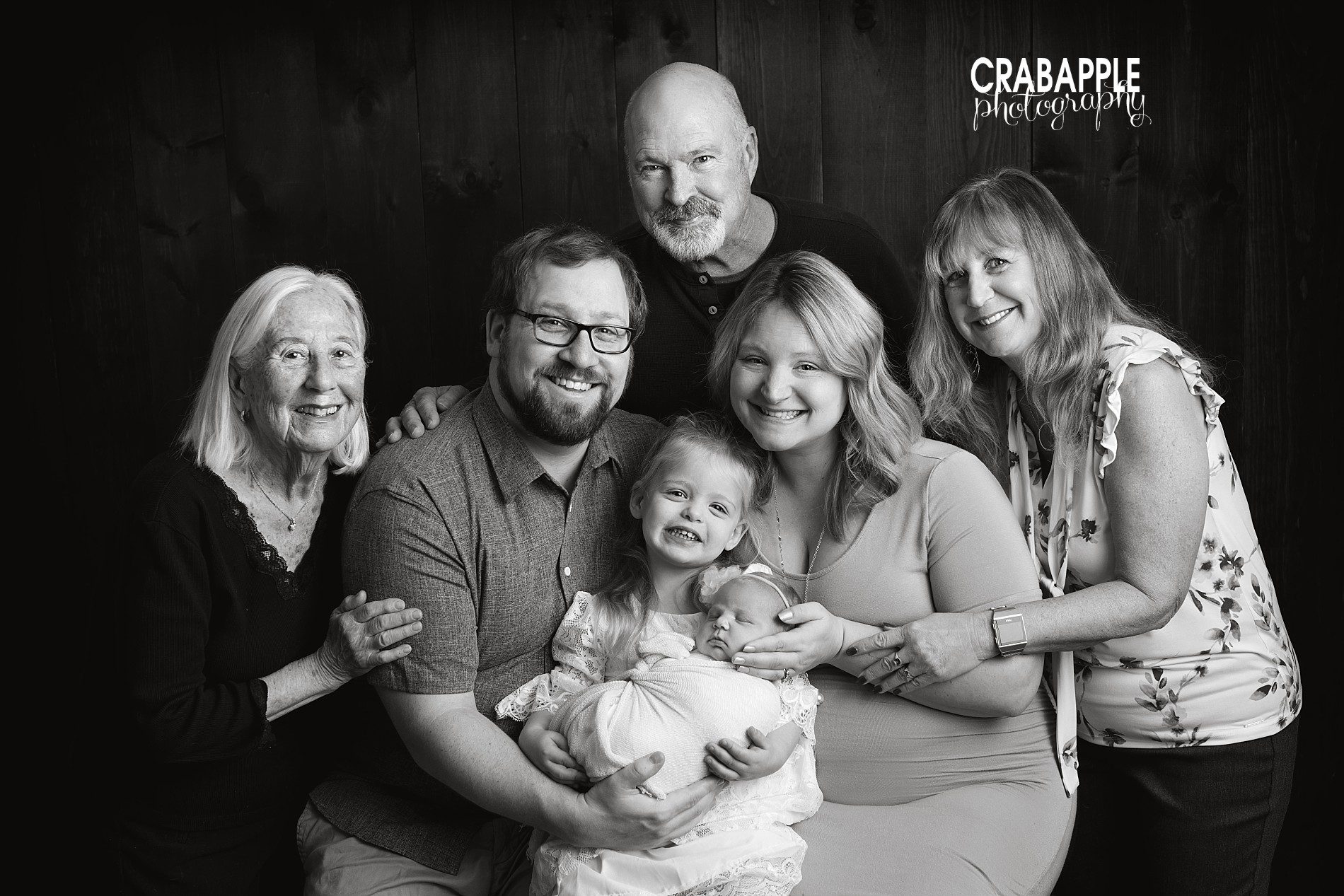 Black and white family portraits with newborn, parents, sister, grandparents and great-grandmother.