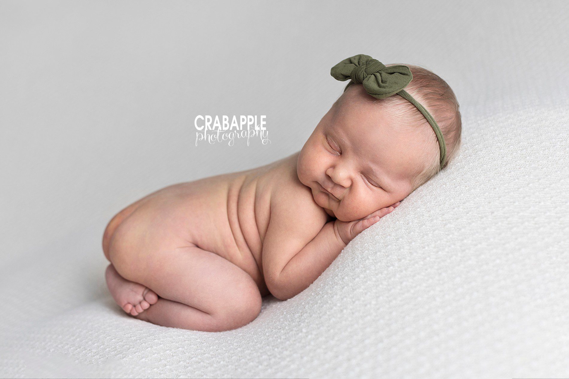 Simple and neutral newborn photos for girls with a pop of green.