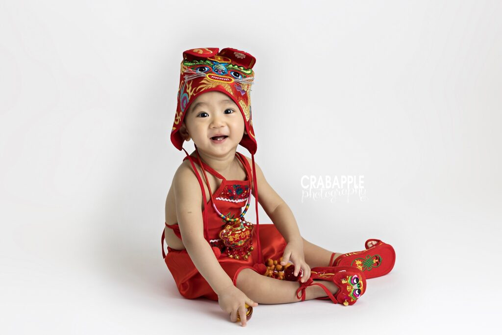 one year old birthday photos east asian traditional clothing