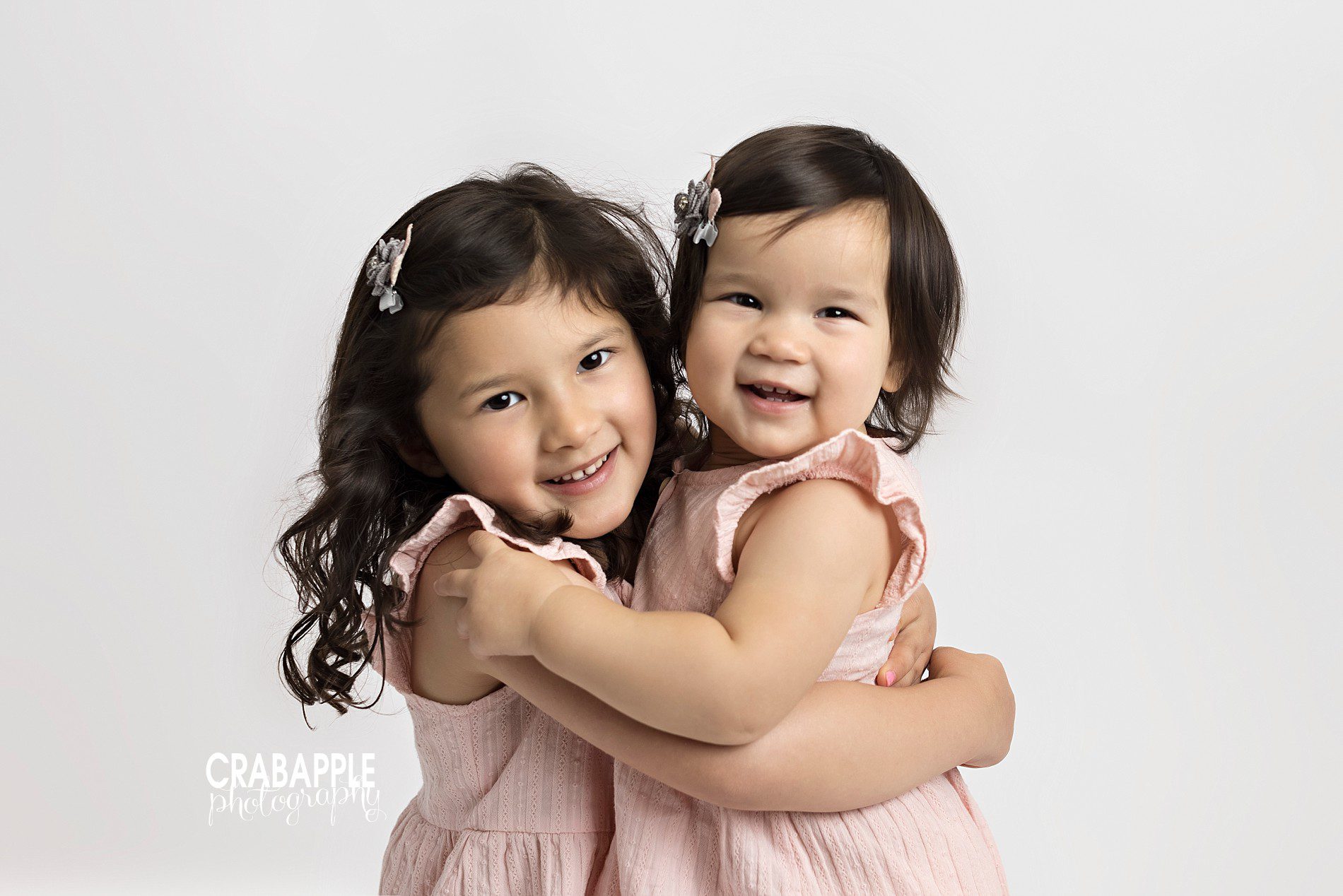 posing ideas for toddler and child sisters
