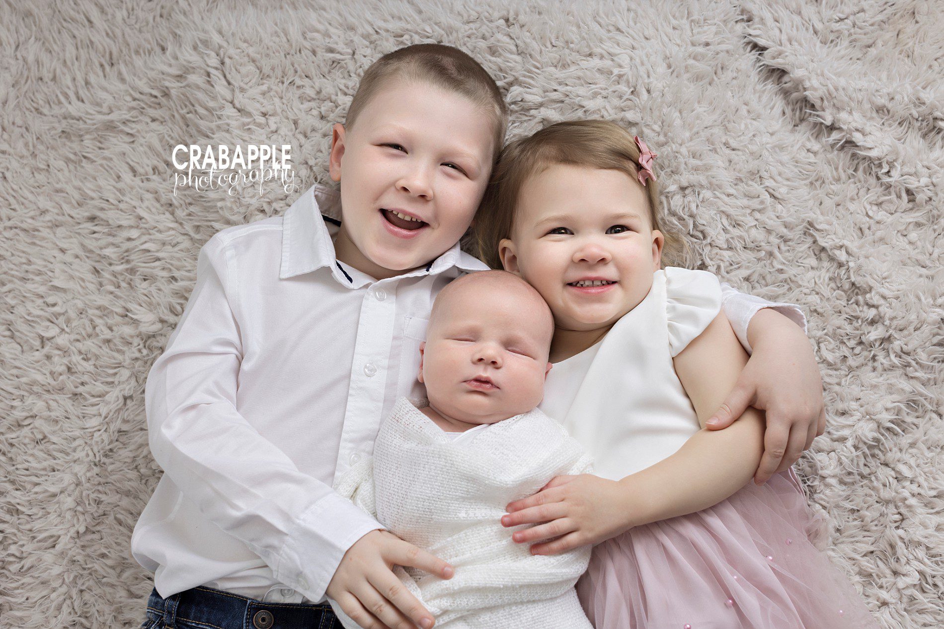 Sibling photos with newborn baby brother.