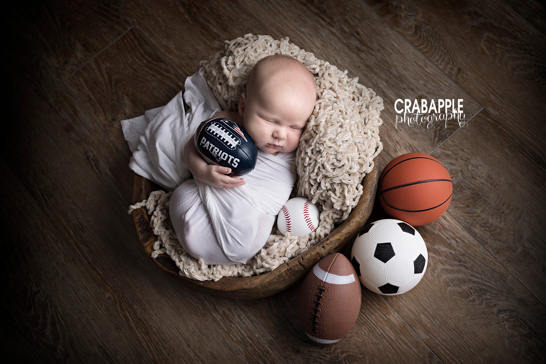 sports themed newborn photos