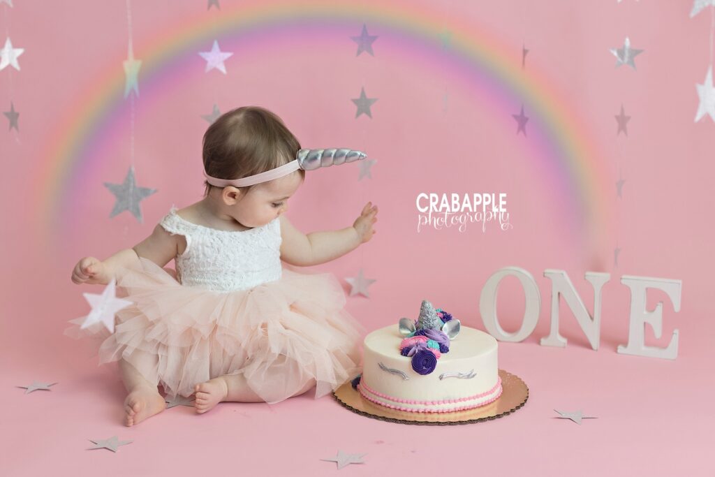 Pastel rainbow and star cake smash with unicorn details