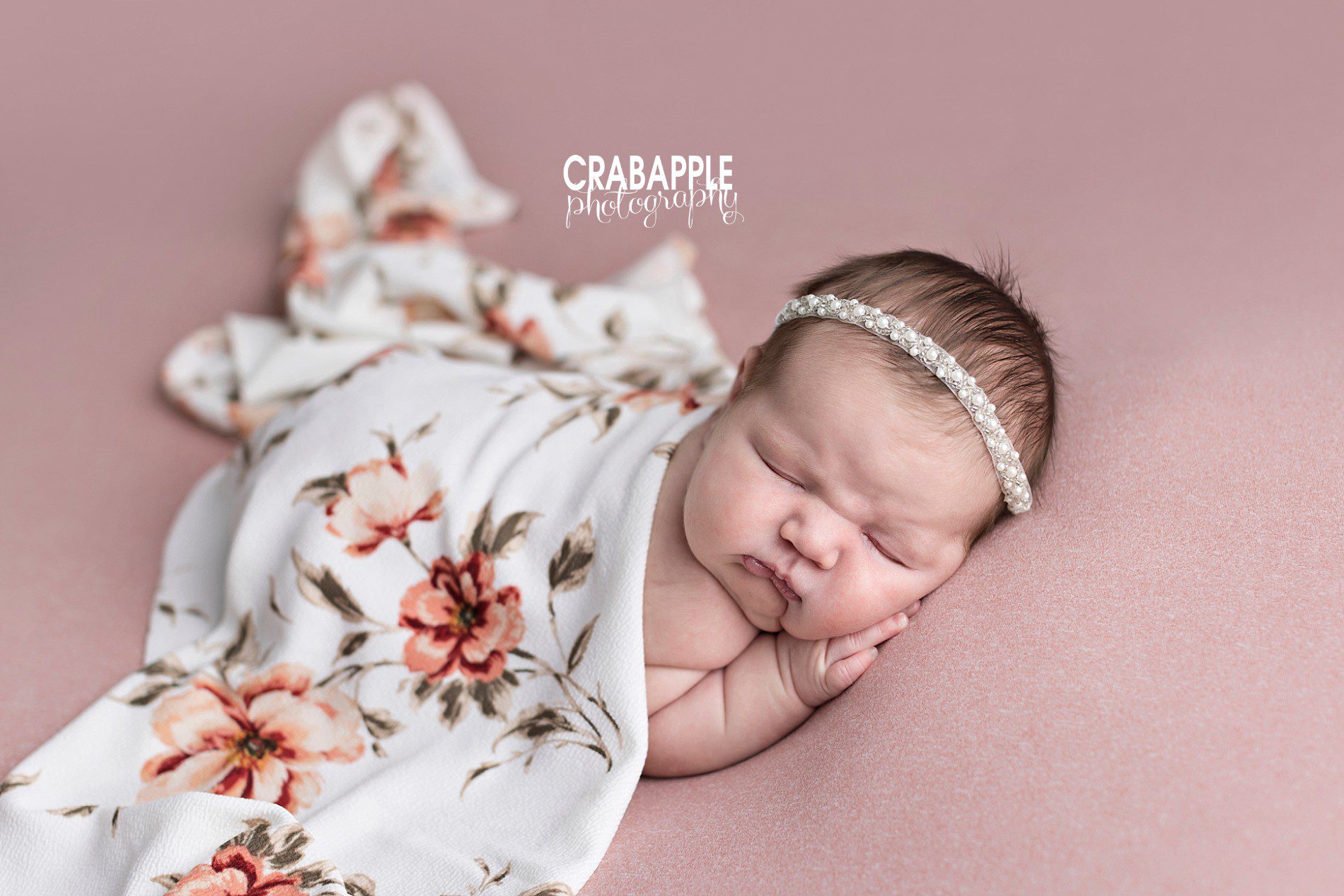 pink and floral newborn photos with pearl headband