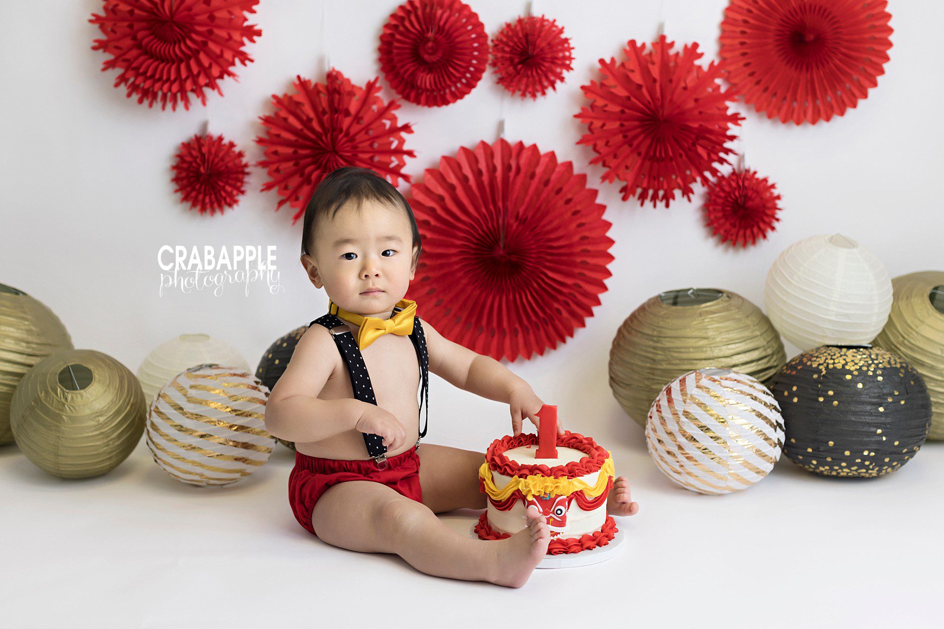 first birthday celebration photos using red and gold
