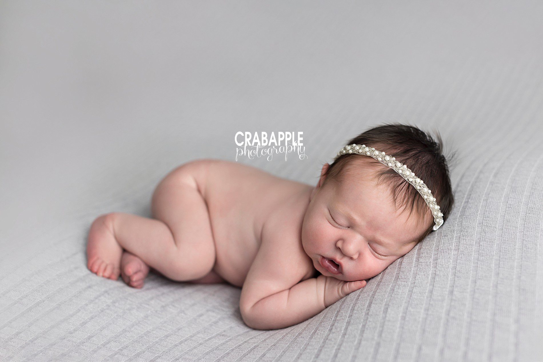 newborn pictures baby girl with headband simple