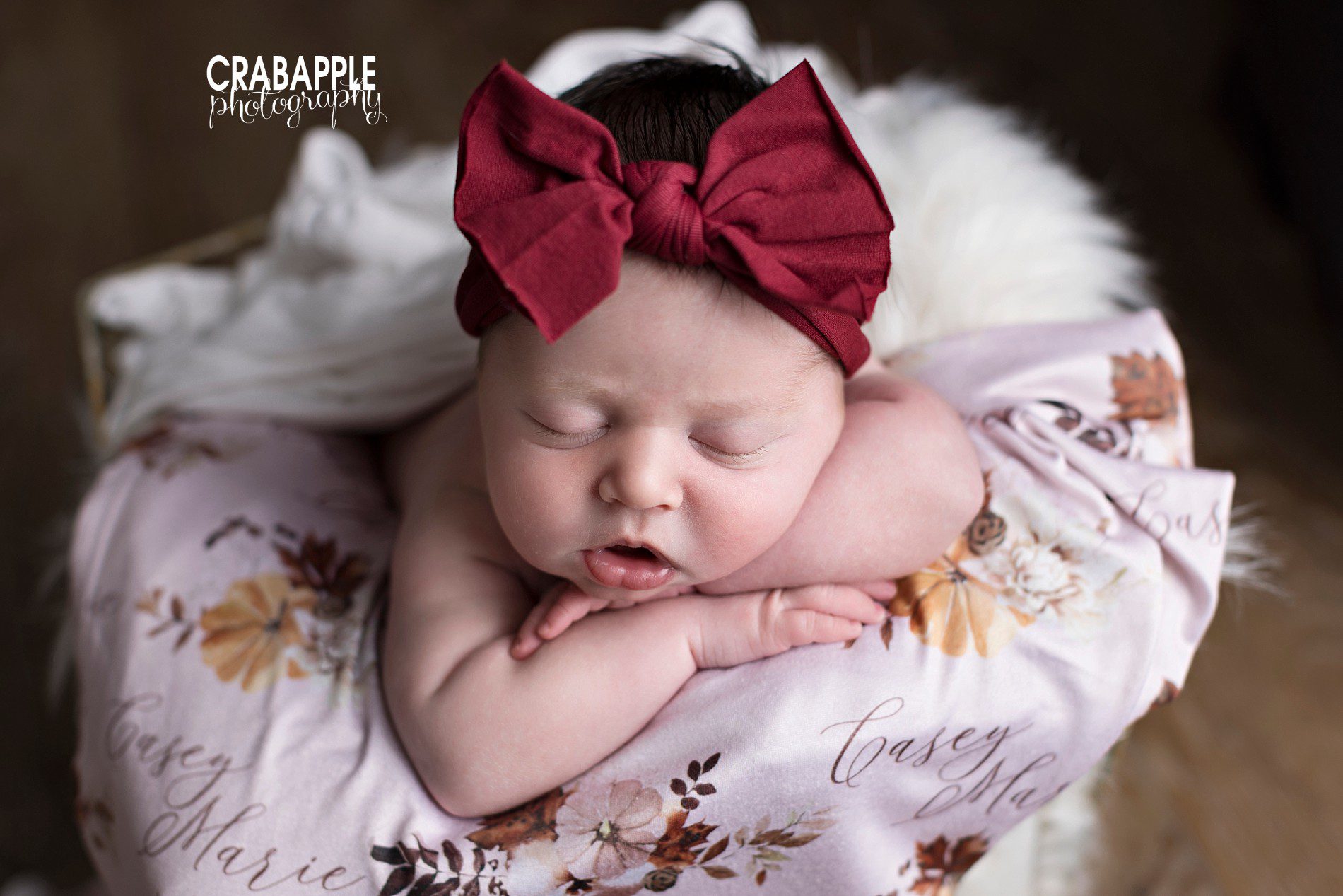 newborn baby girl photos with bow and personalized blanket