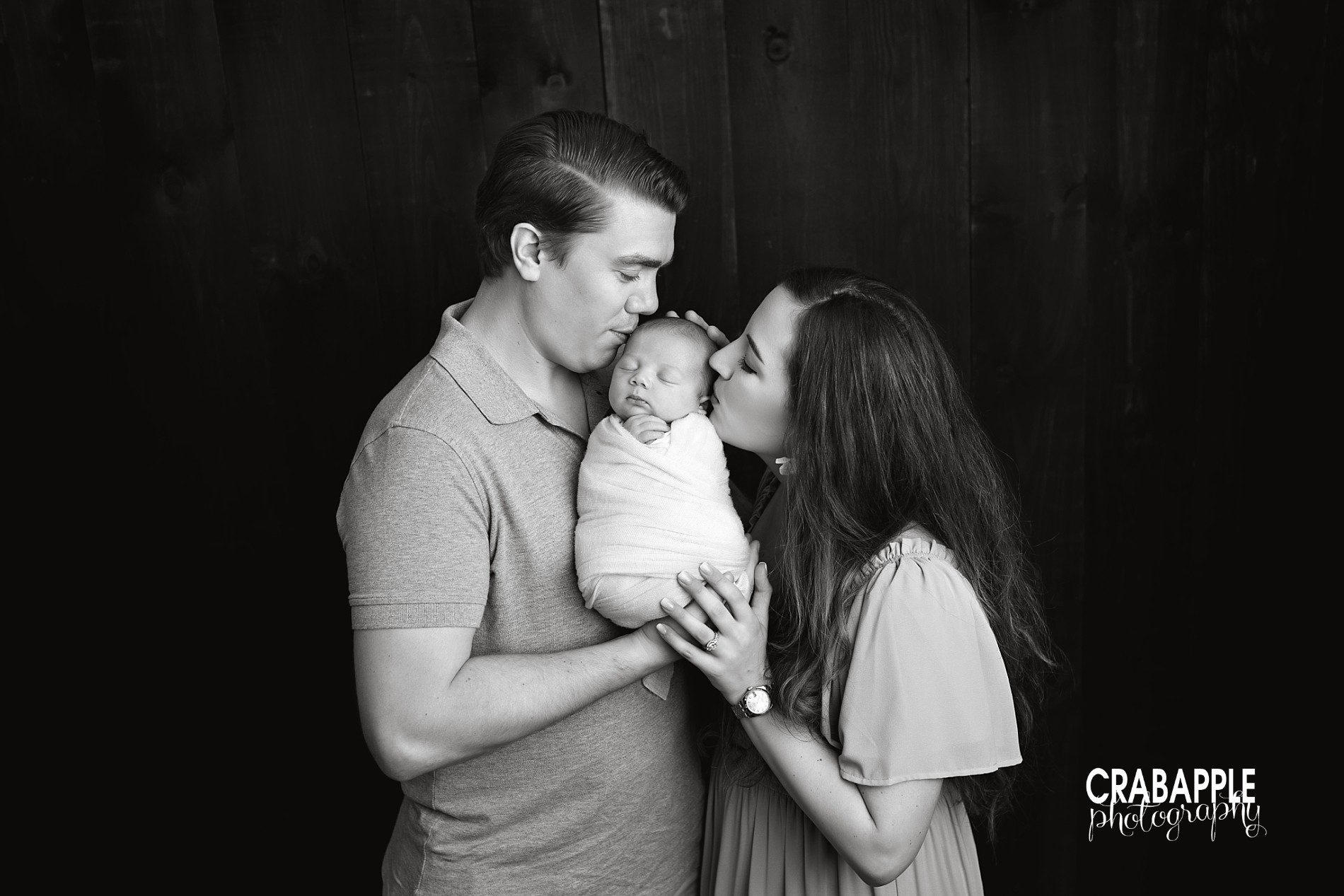 black and white family portrait with newborn