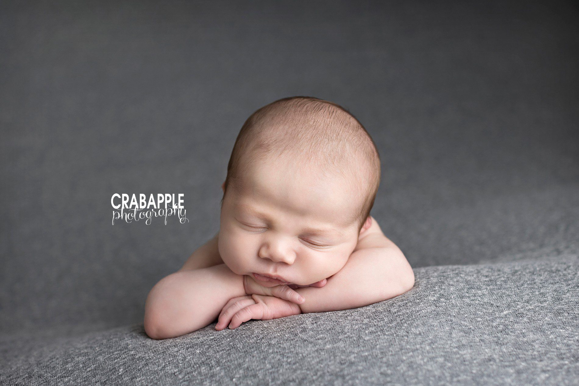 ideas how to pose newborn for professional portraits