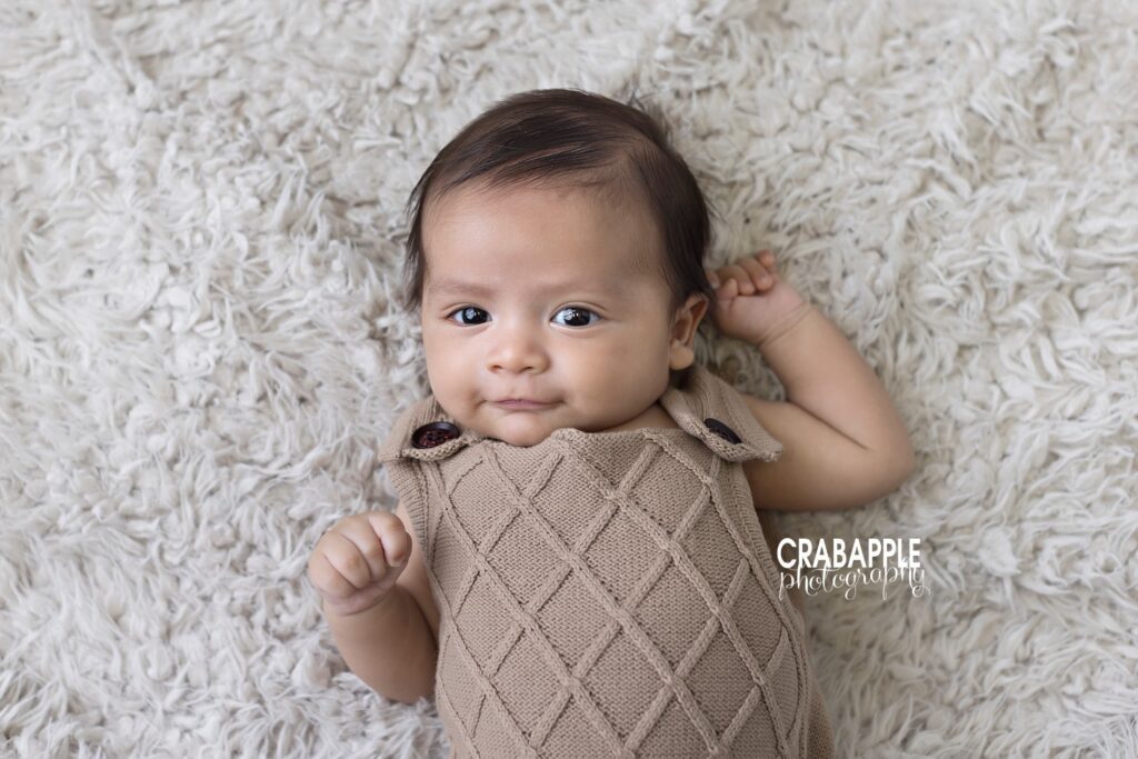 close up portrait of three month old baby boy looking at camera